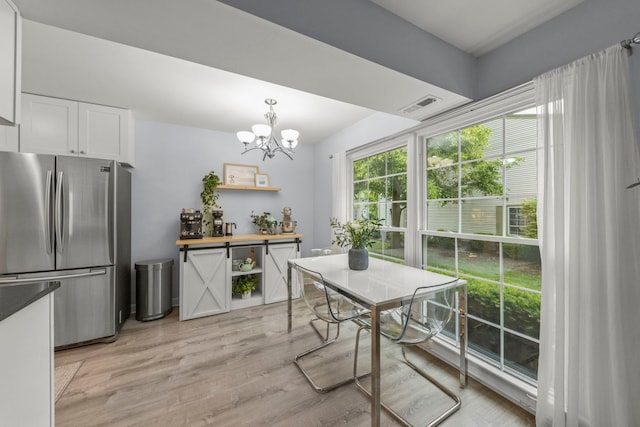 1693 Ashburn Ct Unit B, Wheaton, IL 60189 - dining area featuring a chandelier and light wood-type flooring