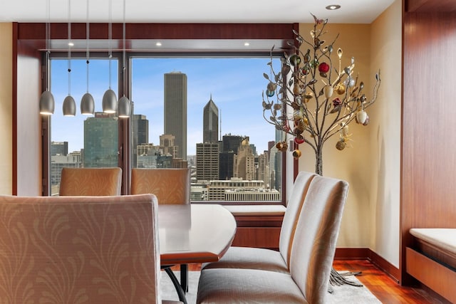 161 E Chicago Ave Unit 33De, Chicago, IL 60611 - dining room featuring wood finished floors and a view of skyline