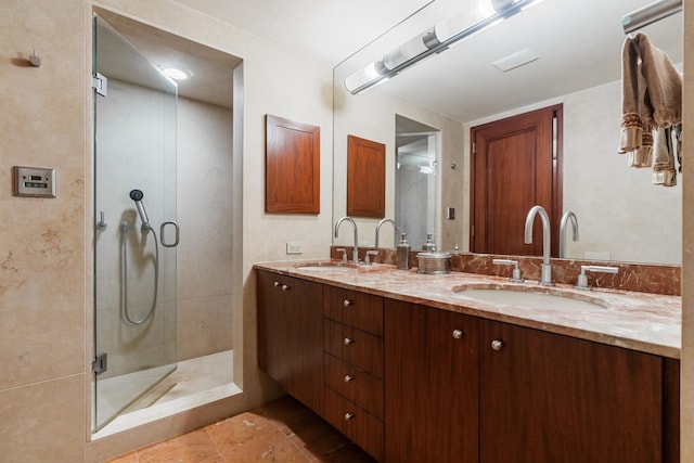 161 E Chicago Ave Unit 33De, Chicago, IL 60611 - bathroom featuring double vanity, a shower stall, and tile patterned floors