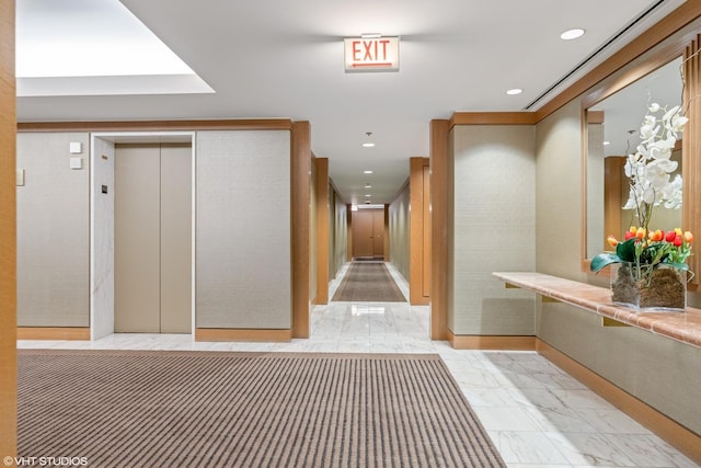 161 E Chicago Ave Unit 33De, Chicago, IL 60611 - hallway featuring light marble finish floors, elevator, and recessed lighting