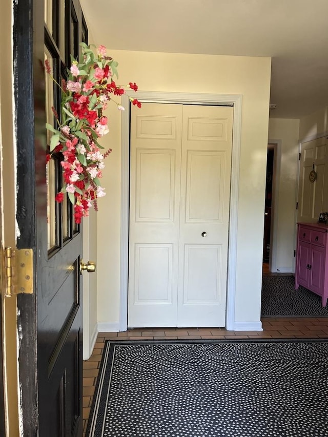 1539 Wincanton Dr, Deerfield, IL 60015 - entrance foyer with baseboards and dark tile patterned floors