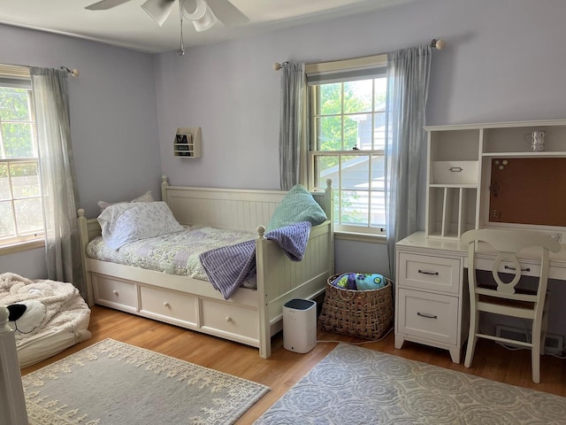 1539 Wincanton Dr, Deerfield, IL 60015 - bedroom with light wood finished floors, a ceiling fan, and wainscoting