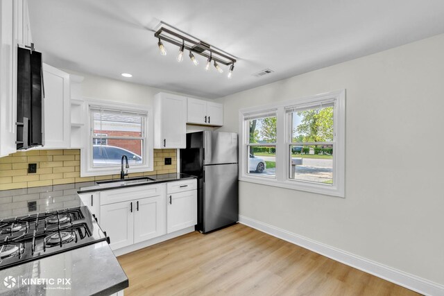 11617 S Kedzie Ave, Merrionette Park, IL 60803 - kitchen with a sink, freestanding refrigerator, baseboards, white cabinetry, and recessed lighting