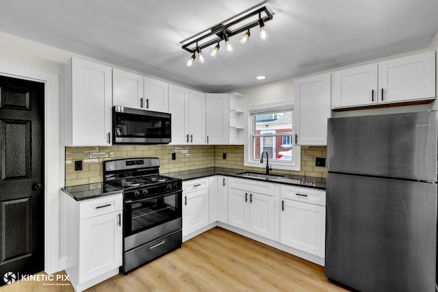 11617 S Kedzie Ave, Merrionette Park, IL 60803 - kitchen with stainless steel appliances, a sink, dark countertops, open shelves, and recessed lighting