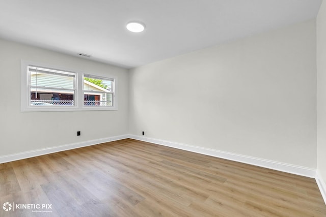 11617 S Kedzie Ave, Merrionette Park, IL 60803 - empty room featuring light wood-style flooring and baseboards