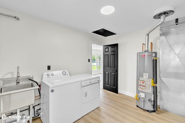 11617 S Kedzie Ave, Merrionette Park, IL 60803 - washroom featuring water heater, light wood-type flooring, separate washer and dryer, and baseboards