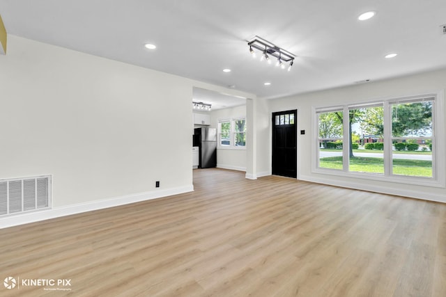 11617 S Kedzie Ave, Merrionette Park, IL 60803 - unfurnished living room featuring light wood-style flooring, baseboards, and recessed lighting