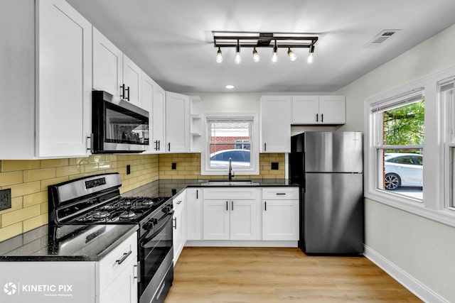 11617 S Kedzie Ave, Merrionette Park, IL 60803 - kitchen featuring appliances with stainless steel finishes, a sink, healthy amount of natural light, open shelves, and recessed lighting