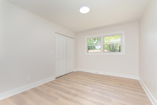 3100 Galena Dr, Joliet, IL 60435 - unfurnished bedroom with light wood-type flooring and a closet