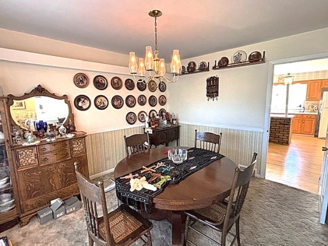 5N265 Neva Ter, Itasca, IL 60143 - dining space featuring a chandelier, a wainscoted wall, and carpet