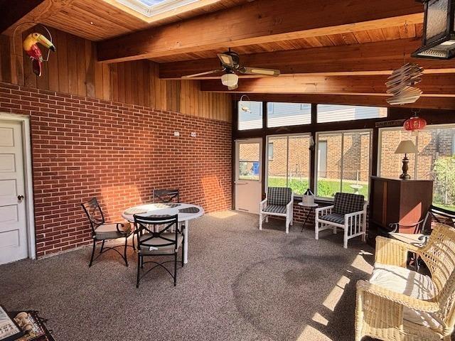 5N265 Neva Ter, Itasca, IL 60143 - sunroom / solarium featuring beamed ceiling, a ceiling fan, and a skylight
