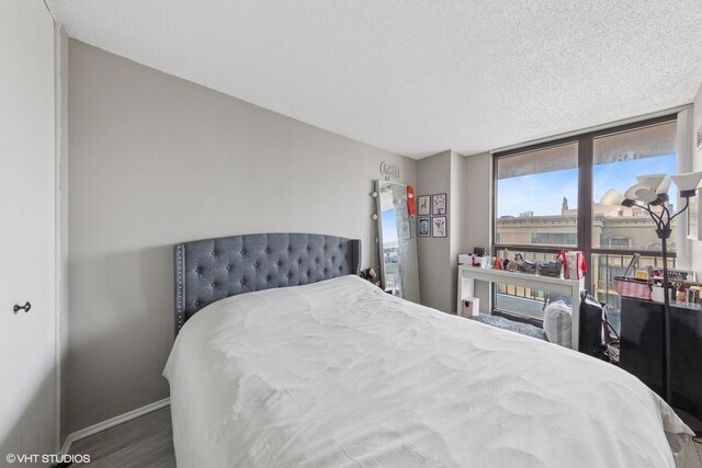 10 E Ontario St Unit 2806, Chicago, IL 60611 - bedroom featuring wood finished floors and a textured ceiling