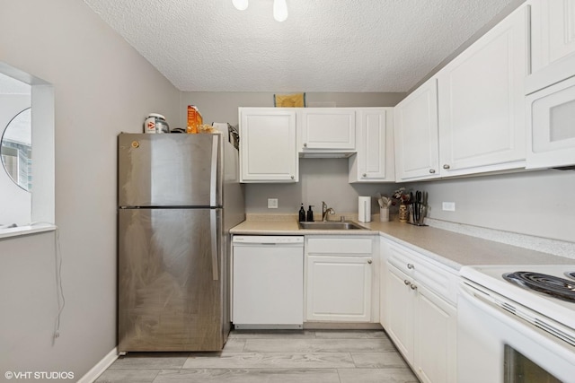 10 E Ontario St Unit 2806, Chicago, IL 60611 - kitchen with white appliances, white cabinets, a textured ceiling, and light countertops