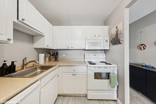 10 E Ontario St Unit 2806, Chicago, IL 60611 - kitchen featuring white appliances, light wood finished floors, white cabinetry, light countertops, and a textured ceiling