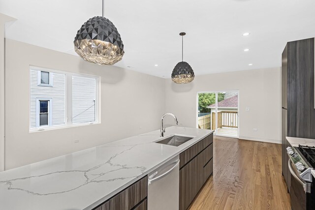 6513 S Langley Ave, Chicago, IL 60637 - kitchen featuring a sink, appliances with stainless steel finishes, modern cabinets, light wood finished floors, and recessed lighting
