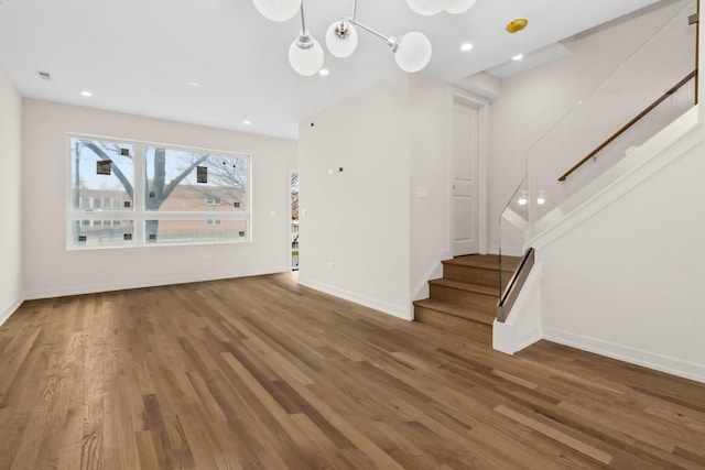 6513 S Langley Ave, Chicago, IL 60637 - unfurnished living room featuring stairway, wood finished floors, baseboards, and recessed lighting