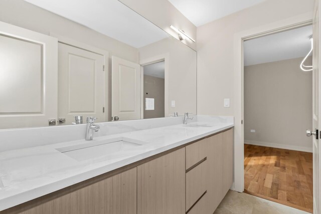 6513 S Langley Ave, Chicago, IL 60637 - bathroom with double vanity and baseboards