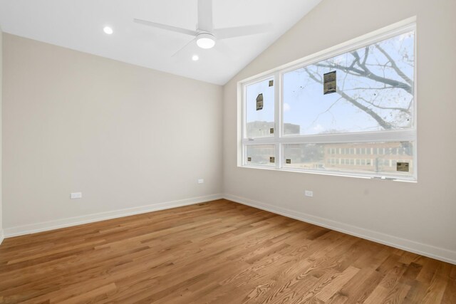 6513 S Langley Ave, Chicago, IL 60637 - spare room featuring light wood finished floors, lofted ceiling, baseboards, a ceiling fan, and recessed lighting