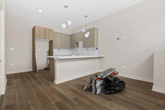 6513 S Langley Ave, Chicago, IL 60637 - kitchen with dark wood-style floors, light countertops, backsplash, and baseboards