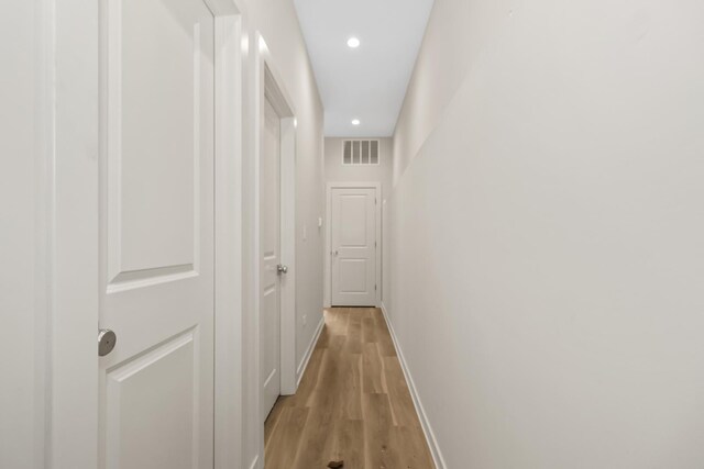 6513 S Langley Ave, Chicago, IL 60637 - corridor featuring light wood finished floors, baseboards, and recessed lighting