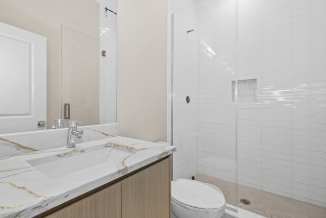 6513 S Langley Ave, Chicago, IL 60637 - bathroom featuring vanity, a stall shower, and toilet