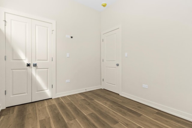 6513 S Langley Ave, Chicago, IL 60637 - unfurnished bedroom featuring wood finished floors and baseboards