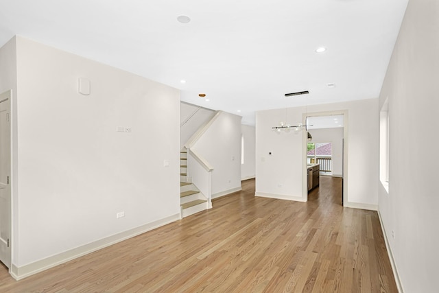 6513 S Langley Ave, Chicago, IL 60637 - unfurnished living room with light wood-type flooring, baseboards, stairway, a chandelier, and recessed lighting