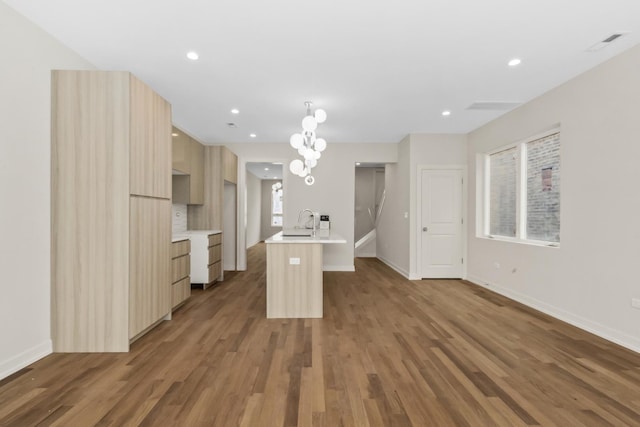 6513 S Langley Ave, Chicago, IL 60637 - kitchen with modern cabinets, light countertops, wood finished floors, baseboards, and recessed lighting