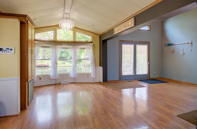 166 Fossil Cove Ln, Wilmington, IL 60481 - interior space featuring wood finished floors, a wainscoted wall, and a chandelier
