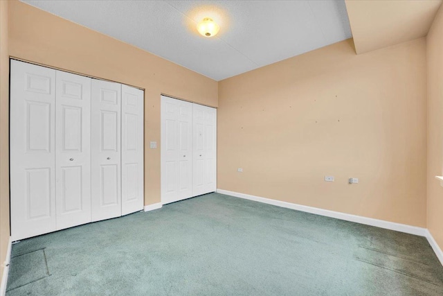 9355 Irving Park Rd Unit 506, Schiller Park, IL 60176 - unfurnished bedroom featuring carpet floors and two closets