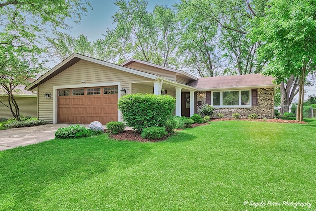 909 Aimtree Pl, Schaumburg, IL 60194 - view of front facade with concrete driveway, an attached garage, and stone siding