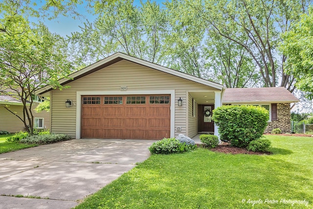 909 Aimtree Pl, Schaumburg, IL 60194 - view of front of home featuring an attached garage, driveway, and a front yard