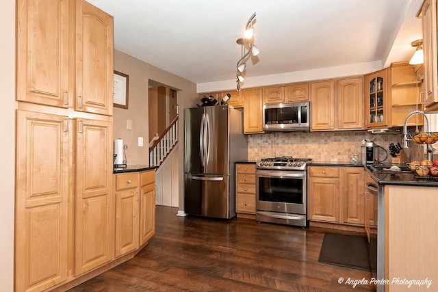 909 Aimtree Pl, Schaumburg, IL 60194 - kitchen featuring appliances with stainless steel finishes, dark countertops, backsplash, dark wood finished floors, and glass insert cabinets