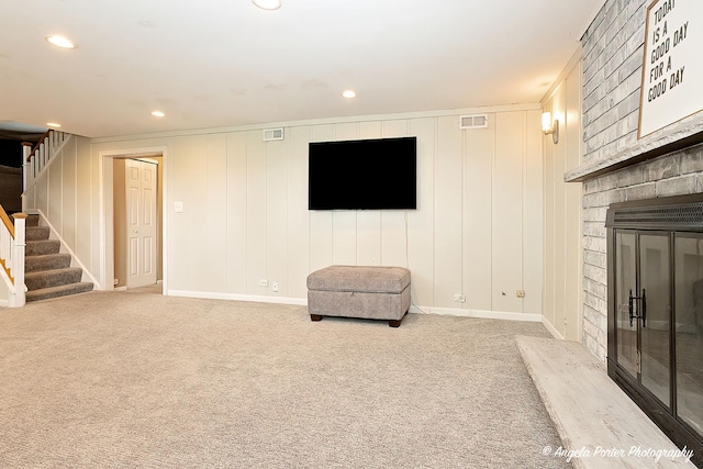 909 Aimtree Pl, Schaumburg, IL 60194 - sitting room with stairs, a brick fireplace, carpet flooring, recessed lighting, and baseboards