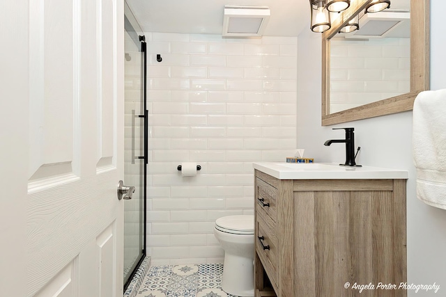 909 Aimtree Pl, Schaumburg, IL 60194 - bathroom with vanity, toilet, tile walls, tile patterned floors, and an enclosed shower