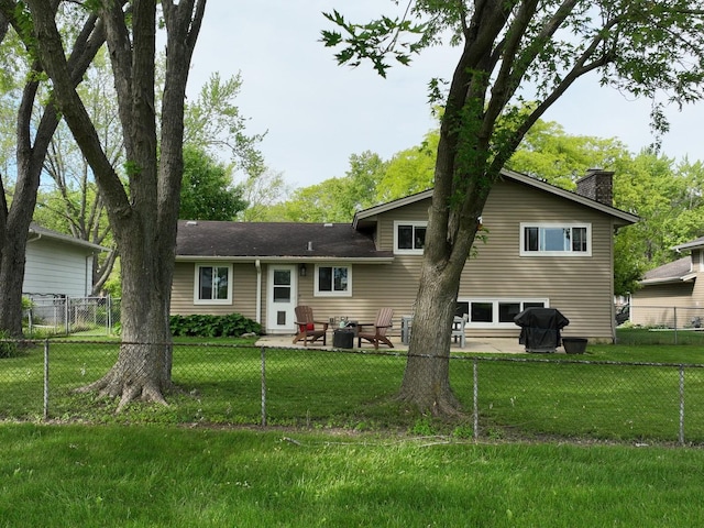 909 Aimtree Pl, Schaumburg, IL 60194 - rear view of house featuring a chimney and a patio