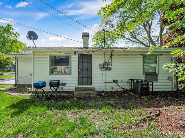 15403 Dorchester Ave, Dolton, IL 60419 - rear view of property featuring entry steps and a chimney