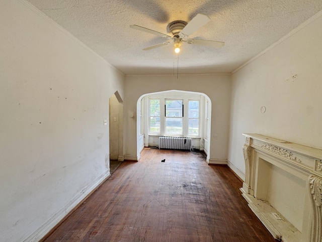 7514 S Rhodes Ave, Chicago, IL 60619 - unfurnished living room featuring radiator heating unit, arched walkways, a textured ceiling, dark wood-style floors, and ceiling fan
