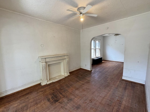 7514 S Rhodes Ave, Chicago, IL 60619 - unfurnished living room with a ceiling fan, arched walkways, ornamental molding, a textured ceiling, and wood finished floors