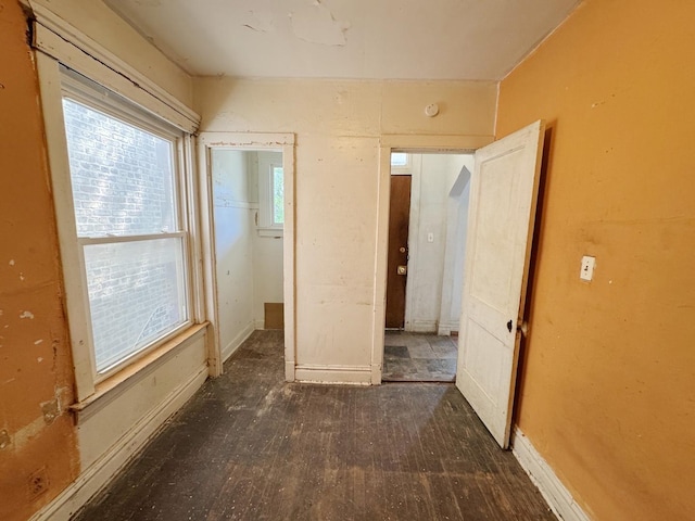 7514 S Rhodes Ave, Chicago, IL 60619 - unfurnished bedroom with baseboards and wood finished floors