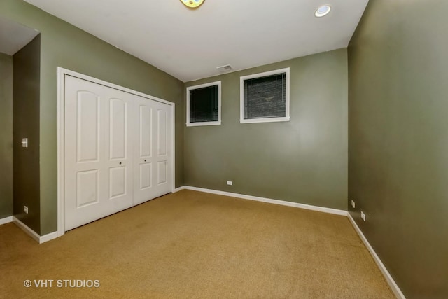 4453 S Berkeley Ave Unit 1, Chicago, IL 60653 - unfurnished bedroom with carpet, baseboards, a closet, and recessed lighting