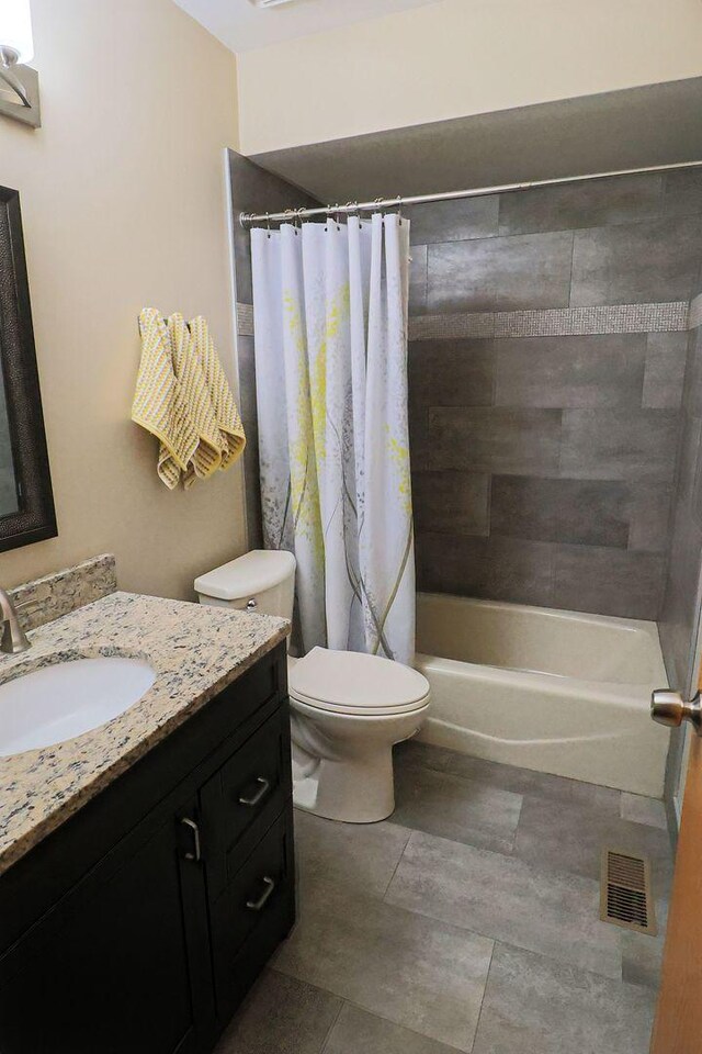 523 Jaquays St, Lockport, IL 60441 - full bathroom with vanity, toilet, shower / bath combo, and tile patterned flooring