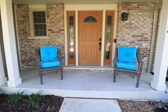 523 Jaquays St, Lockport, IL 60441 - view of exterior entry with covered porch and brick siding