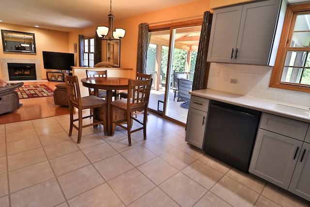523 Jaquays St, Lockport, IL 60441 - dining room with light tile patterned flooring, a tiled fireplace, and recessed lighting