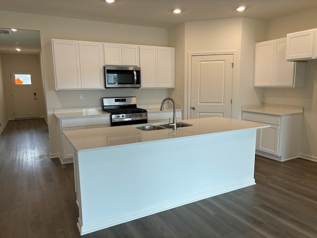 2280 Elderberry Ct, Wonder Lake, IL 60097 - kitchen featuring appliances with stainless steel finishes, a sink, white cabinets, an island with sink, and recessed lighting