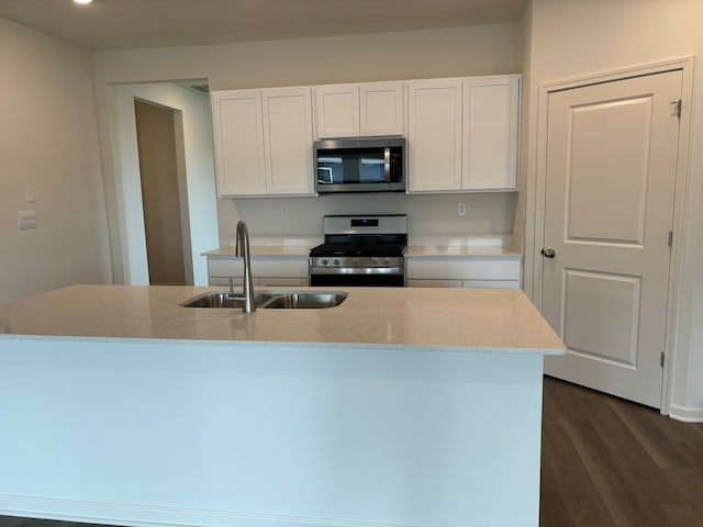 2280 Elderberry Ct, Wonder Lake, IL 60097 - kitchen with stainless steel appliances, a sink, white cabinets, and dark wood finished floors