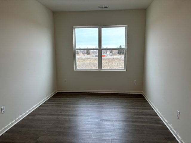 2280 Elderberry Ct, Wonder Lake, IL 60097 - empty room with dark wood finished floors and baseboards