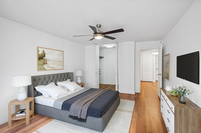 10 E Ontario St Unit 3609, Chicago, IL 60611 - bedroom with light wood-style flooring, ceiling fan, and a spacious closet