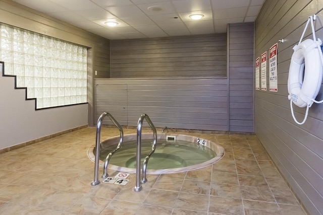 10 E Ontario St Unit 3609, Chicago, IL 60611 - miscellaneous room with baseboards, a paneled ceiling, tile patterned flooring, and a hot tub