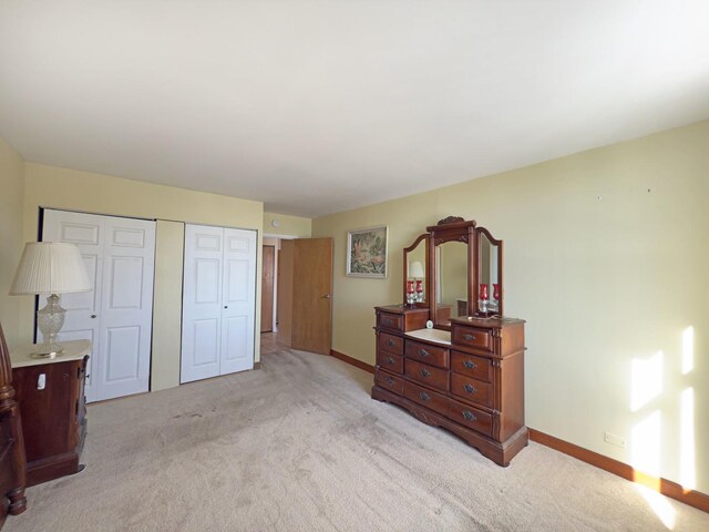 33 N Main St Unit 4J, Lombard, IL 60148 - bedroom featuring light colored carpet and two closets